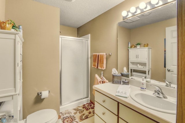 3327 23rd Ave S, Fargo, ND 58103 - bathroom with vanity, a stall shower, a textured ceiling, and tile patterned flooring