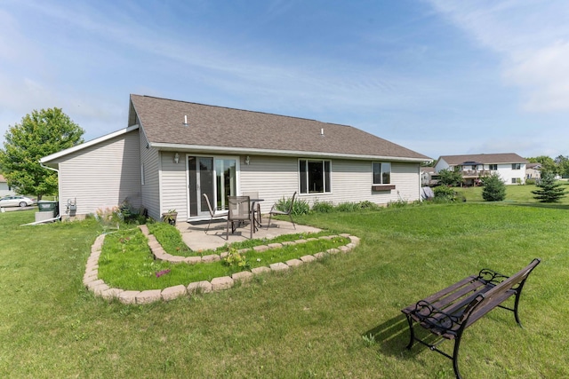 603 7th Ave, Osakis, MN 56360 - back of house featuring a patio, a lawn, and roof with shingles
