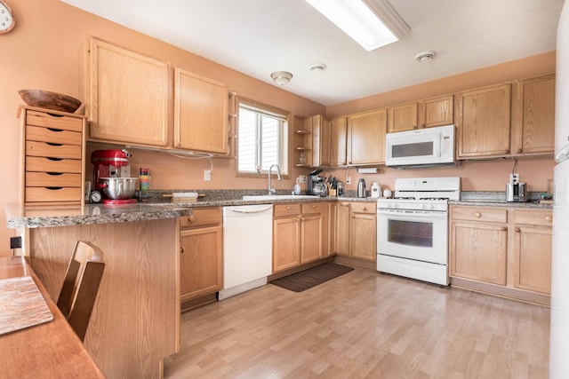 603 7th Ave, Osakis, MN 56360 - kitchen featuring white appliances, light brown cabinetry, light wood-type flooring, and open shelves