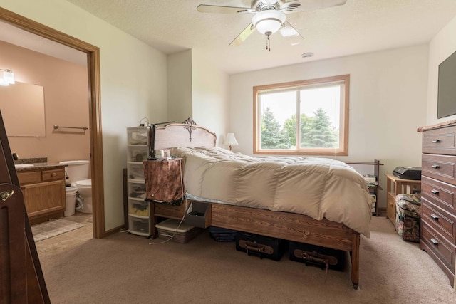 603 7th Ave, Osakis, MN 56360 - bedroom with light colored carpet, connected bathroom, and ceiling fan