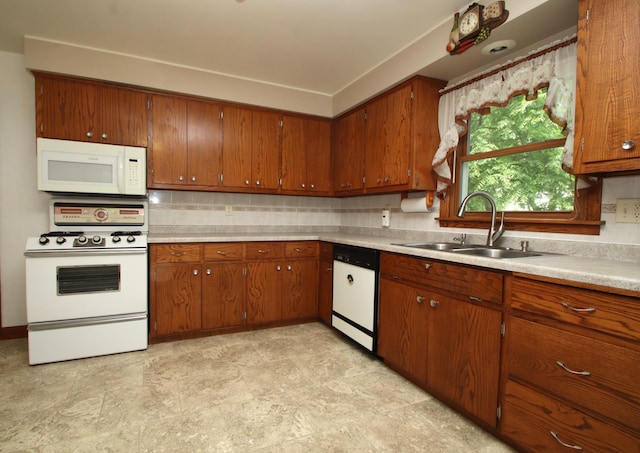 842 19th Ave N, Saint Cloud, MN 56303 - kitchen featuring white appliances, brown cabinets, light countertops, and tasteful backsplash