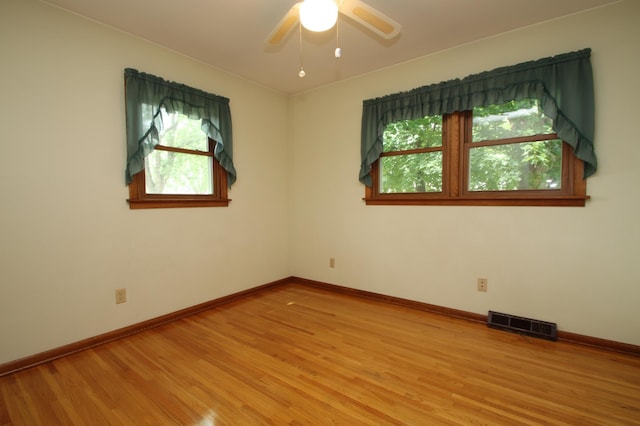 842 19th Ave N, Saint Cloud, MN 56303 - spare room with healthy amount of natural light, light wood finished floors, and ceiling fan