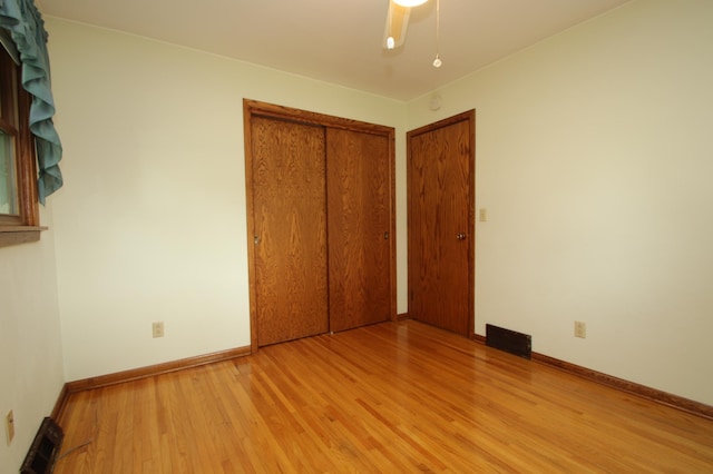 842 19th Ave N, Saint Cloud, MN 56303 - unfurnished bedroom with wood finished floors and a closet