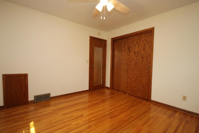 842 19th Ave N, Saint Cloud, MN 56303 - unfurnished bedroom featuring light wood finished floors, a closet, and ceiling fan