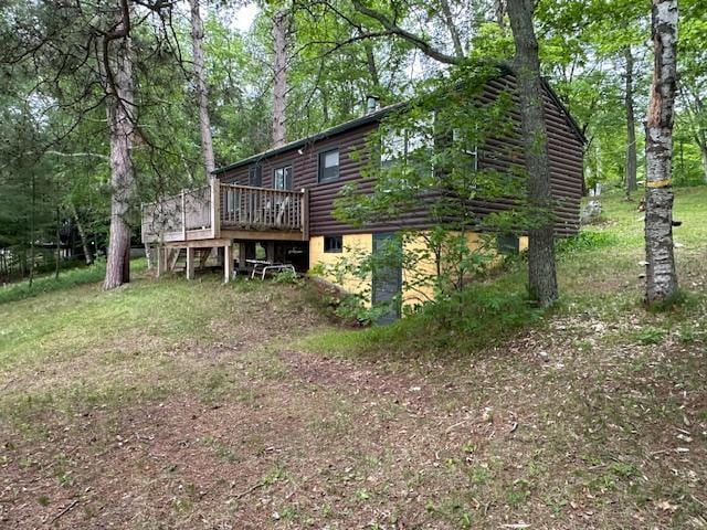 20519 485th St, Mcgregor, MN 55760 - rear view of house featuring log veneer siding and a wooden deck
