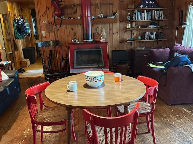 20519 485th St, Mcgregor, MN 55760 - dining area featuring hardwood / wood-style floors and wood walls
