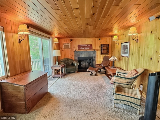 8243 Greer Ave NW, Maple Lake, MN 55358 - living room with wooden walls, carpet flooring, a fireplace, wooden ceiling, and a wall mounted air conditioner
