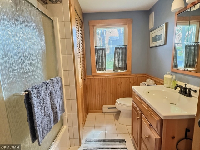 8243 Greer Ave NW, Maple Lake, MN 55358 - bathroom featuring a baseboard heating unit, vanity, healthy amount of natural light, wainscoting, and tile patterned flooring