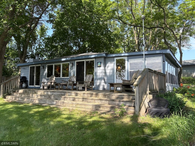 8243 Greer Ave NW, Maple Lake, MN 55358 - back of house featuring a deck and a yard