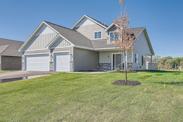 3483 Kady Ave NE, Saint Michael, MN 55376 - view of front of house featuring an attached garage, stone siding, a front lawn, concrete driveway, and roof with shingles