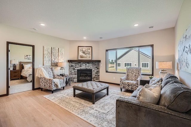3483 Kady Ave NE, Saint Michael, MN 55376 - living room featuring light wood-type flooring, recessed lighting, and a fireplace