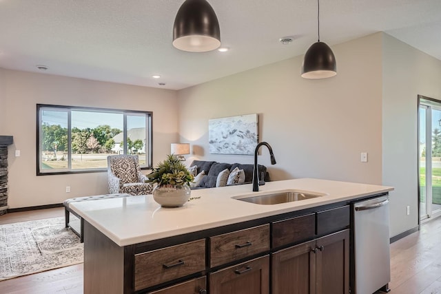 3483 Kady Ave NE, Saint Michael, MN 55376 - kitchen with stainless steel dishwasher, light wood finished floors, open floor plan, light countertops, and recessed lighting