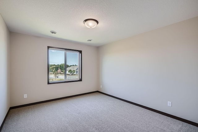 3483 Kady Ave NE, Saint Michael, MN 55376 - empty room featuring carpet floors, a textured ceiling, and a smoke detector