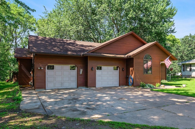 505 Brookview Ln SW, Isanti, MN 55040 - view of front of home featuring an attached garage, concrete driveway, and roof with shingles