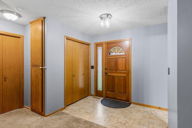 505 Brookview Ln SW, Isanti, MN 55040 - foyer entrance with baseboards and a textured ceiling