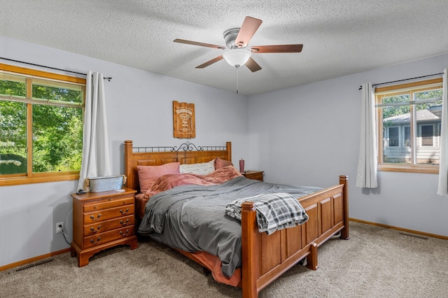 505 Brookview Ln SW, Isanti, MN 55040 - bedroom featuring light colored carpet, a textured ceiling, and ceiling fan