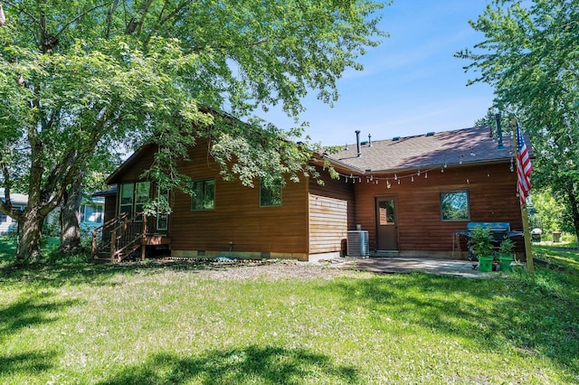 505 Brookview Ln SW, Isanti, MN 55040 - rear view of house with a yard, a patio, and roof with shingles