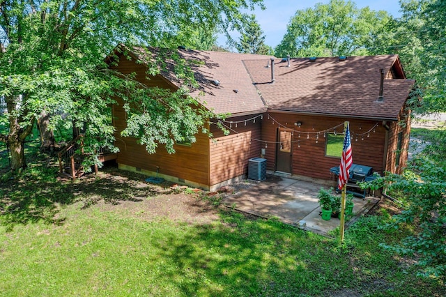 505 Brookview Ln SW, Isanti, MN 55040 - rear view of house with a patio, a shingled roof, crawl space, and a lawn