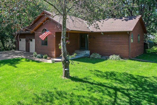 505 Brookview Ln SW, Isanti, MN 55040 - view of front of house with a garage, a front lawn, concrete driveway, and a shingled roof