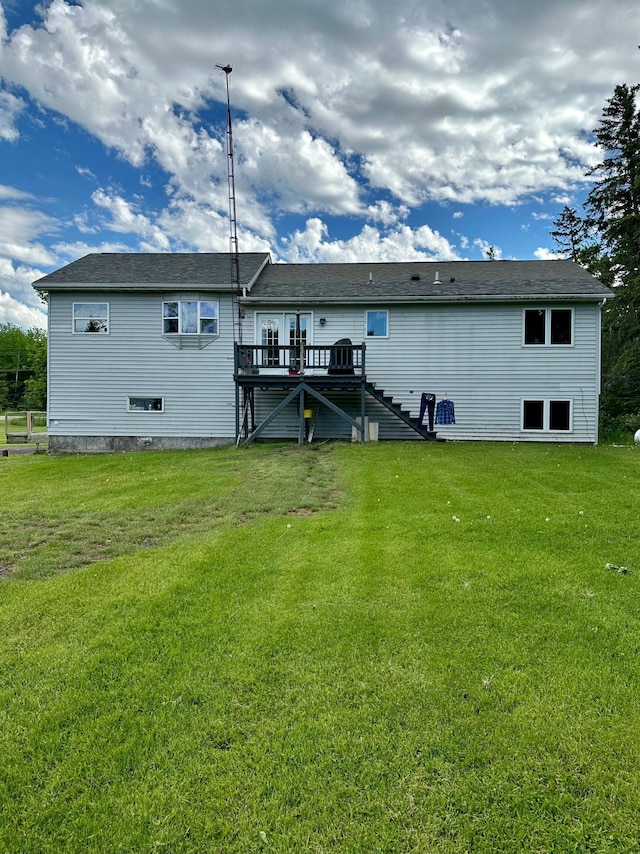 5735 County Road 1, Littlefork, MN 56653 - back of house featuring stairs, a deck, and a lawn