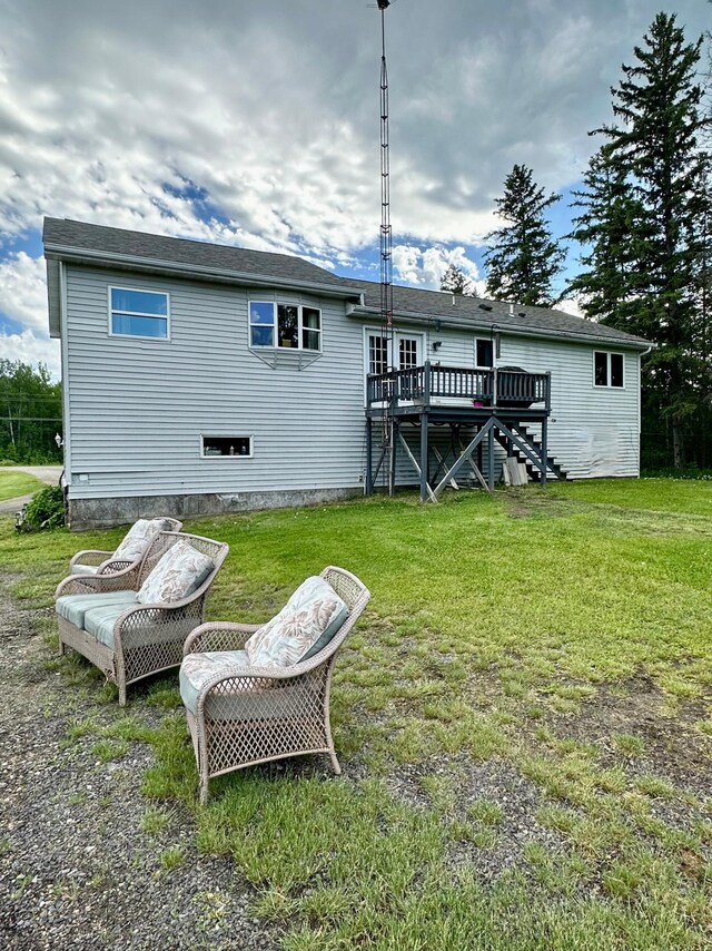 5735 County Road 1, Littlefork, MN 56653 - back of property featuring a wooden deck, stairway, and a lawn