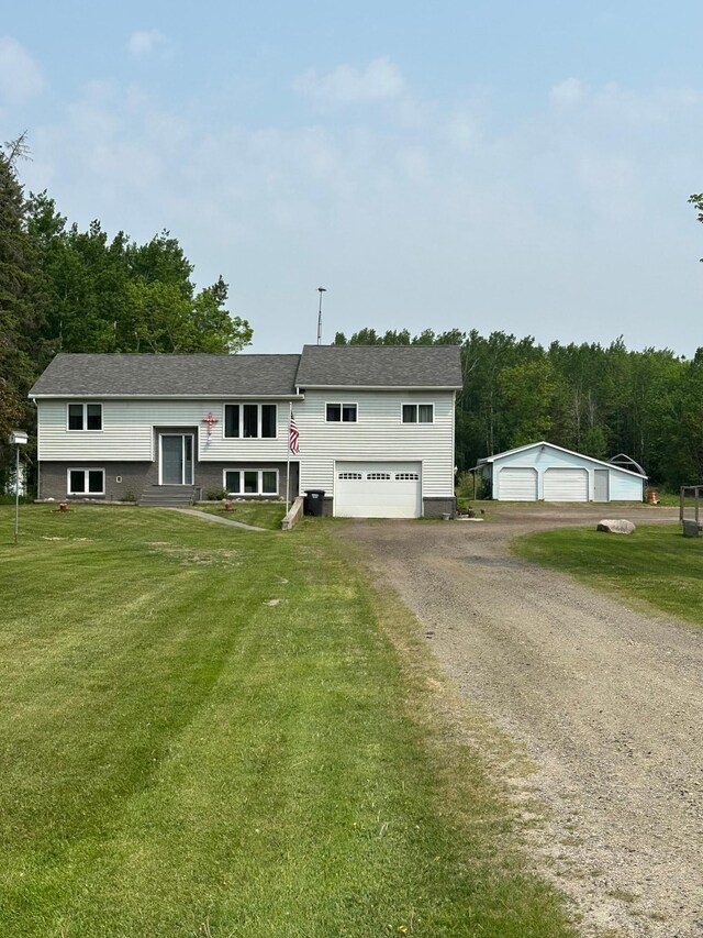 5735 County Road 1, Littlefork, MN 56653 - split foyer home with a front yard, entry steps, and driveway