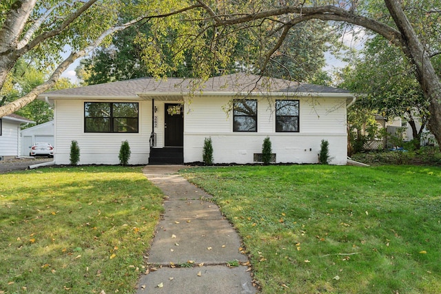 242 Butler Ave W, West Saint Paul, MN 55118 - view of front of property featuring a front lawn, brick siding, and roof with shingles