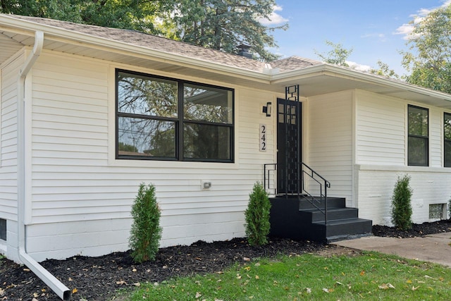 242 Butler Ave W, West Saint Paul, MN 55118 - doorway to property with a shingled roof