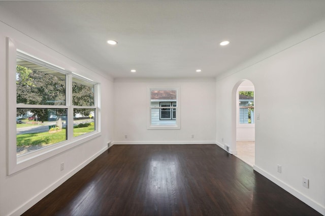 242 Butler Ave W, West Saint Paul, MN 55118 - spare room with arched walkways, dark wood finished floors, and recessed lighting