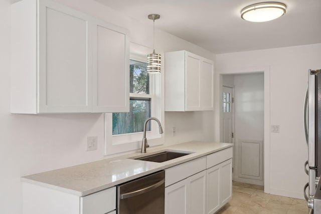 242 Butler Ave W, West Saint Paul, MN 55118 - kitchen featuring appliances with stainless steel finishes, white cabinets, light countertops, and hanging light fixtures