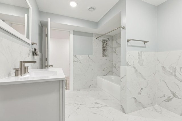 242 Butler Ave W, West Saint Paul, MN 55118 - bathroom featuring double vanity, a combined bath / shower with marble appearance, and marble finish flooring