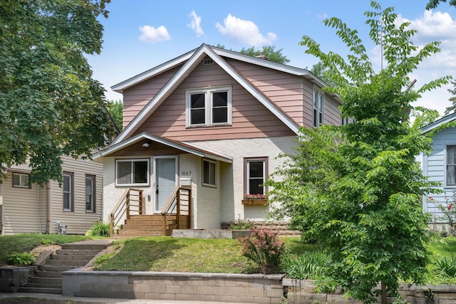 1067 Van Buren Ave, Saint Paul, MN 55104 - view of front of house featuring entry steps and stucco siding