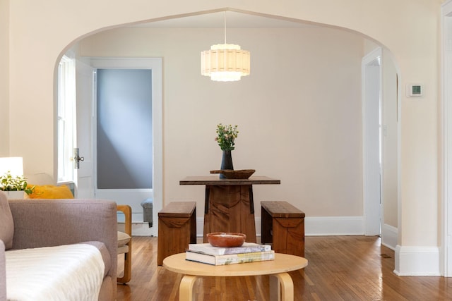 1067 Van Buren Ave, Saint Paul, MN 55104 - dining room with arched walkways and wood finished floors