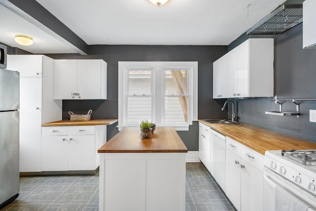 1067 Van Buren Ave, Saint Paul, MN 55104 - kitchen featuring wood counters, white appliances, tasteful backsplash, white cabinetry, and a kitchen island