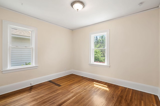 1067 Van Buren Ave, Saint Paul, MN 55104 - unfurnished room featuring a smoke detector, wood finished floors, and ornamental molding