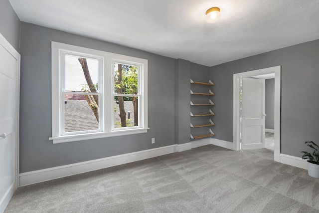 1067 Van Buren Ave, Saint Paul, MN 55104 - carpeted empty room with baseboards