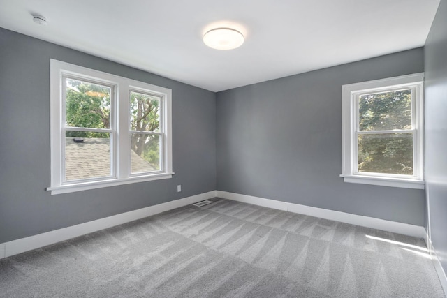 1067 Van Buren Ave, Saint Paul, MN 55104 - carpeted empty room featuring a smoke detector and healthy amount of natural light