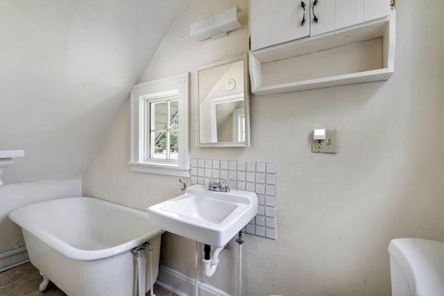 1067 Van Buren Ave, Saint Paul, MN 55104 - full bathroom featuring vaulted ceiling and a soaking tub