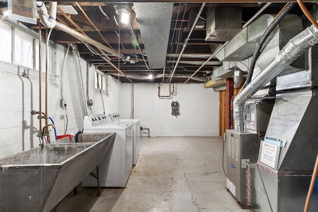1067 Van Buren Ave, Saint Paul, MN 55104 - unfinished basement featuring separate washer and dryer and heating unit