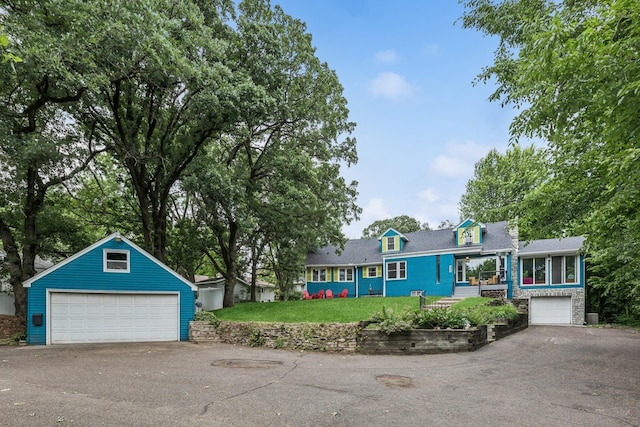 4837 Diane Dr, Minnetonka, MN 55343 - view of front facade featuring an outdoor structure, a garage, and a front yard