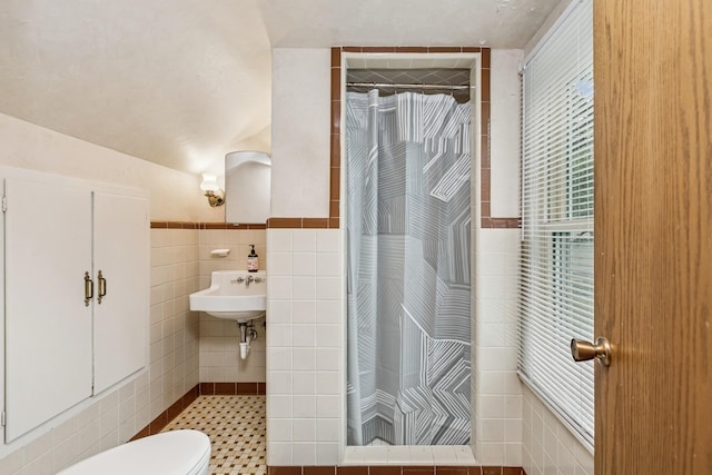 4837 Diane Dr, Minnetonka, MN 55343 - bathroom with tile walls, a shower with curtain, healthy amount of natural light, and wainscoting
