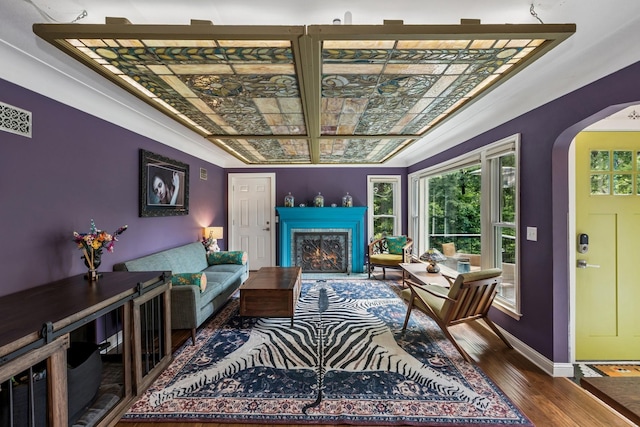 4837 Diane Dr, Minnetonka, MN 55343 - living room with wood finished floors, arched walkways, plenty of natural light, a warm lit fireplace, and coffered ceiling