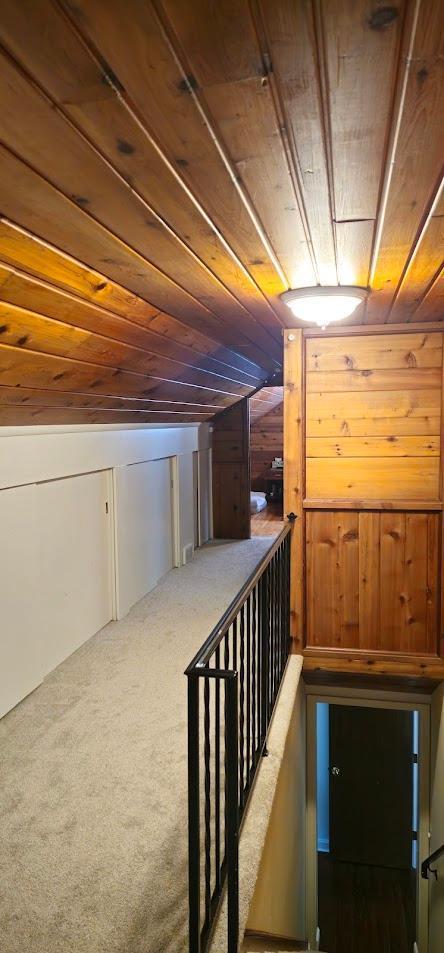 4837 Diane Dr, Minnetonka, MN 55343 - staircase featuring wood ceiling, carpet floors, vaulted ceiling, and wood walls
