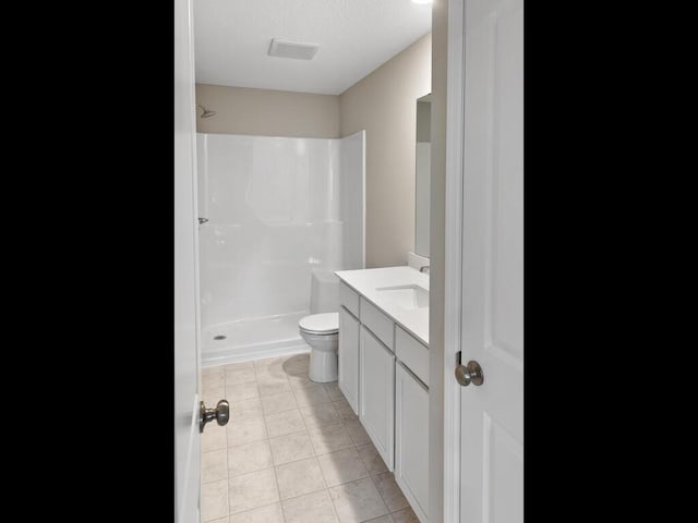 6714 Granby St, North Branch, MN 55056 - full bathroom featuring vanity, a shower, and tile patterned floors