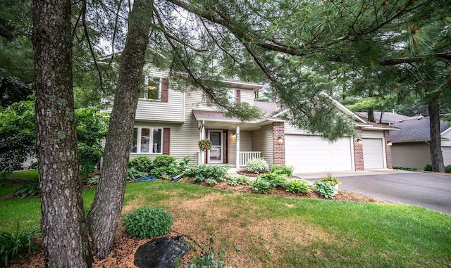 452 Spruce St, Shakopee, MN 55379 - traditional-style house with driveway, an attached garage, a front lawn, and brick siding