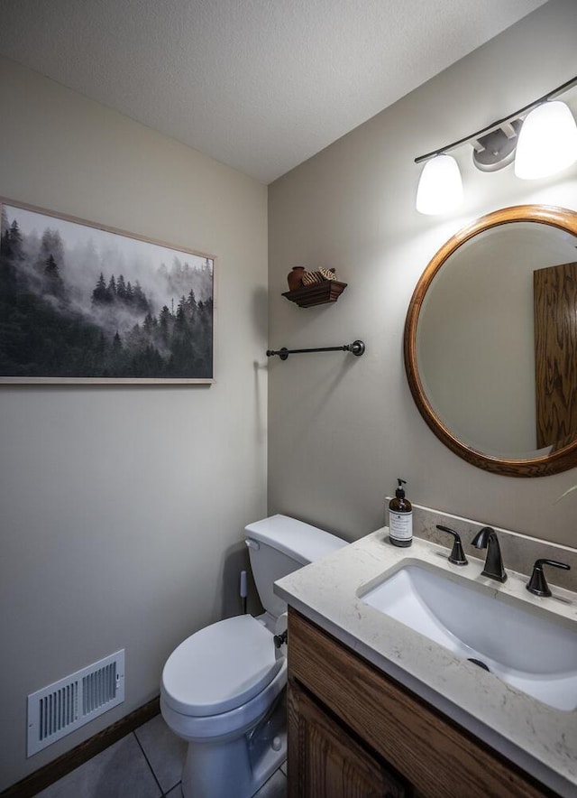 452 Spruce St, Shakopee, MN 55379 - half bath featuring vanity, tile patterned floors, and a textured ceiling