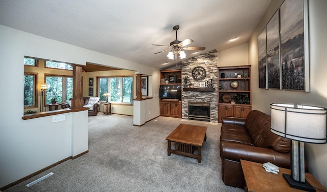 452 Spruce St, Shakopee, MN 55379 - living room featuring a ceiling fan, a stone fireplace, light carpet, and vaulted ceiling