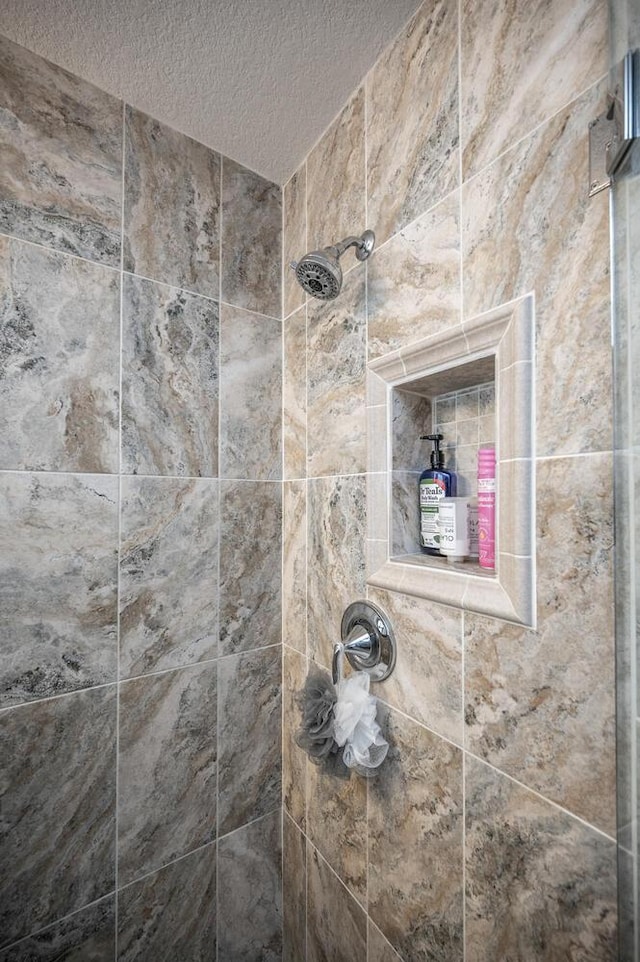 452 Spruce St, Shakopee, MN 55379 - bathroom view of a textured ceiling and tiled shower