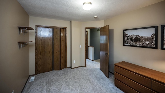 452 Spruce St, Shakopee, MN 55379 - carpeted bedroom with a closet and a textured ceiling