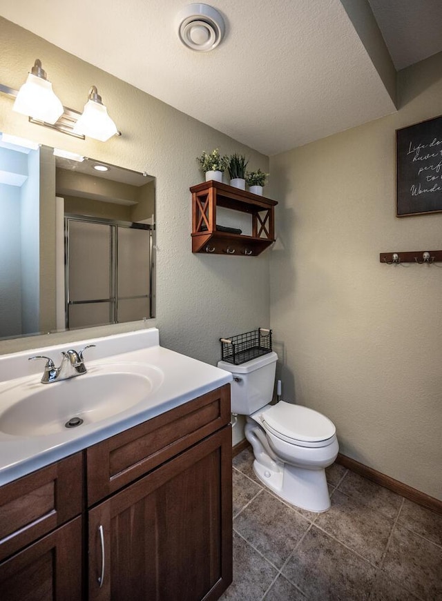 452 Spruce St, Shakopee, MN 55379 - bathroom with vanity, a shower with door, tile patterned floors, and a textured ceiling